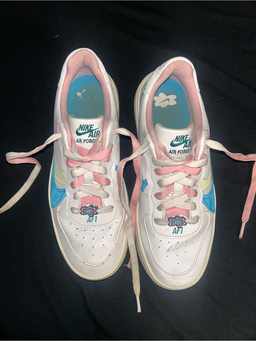 Nike White Sneakers with Pink and Blue Accents